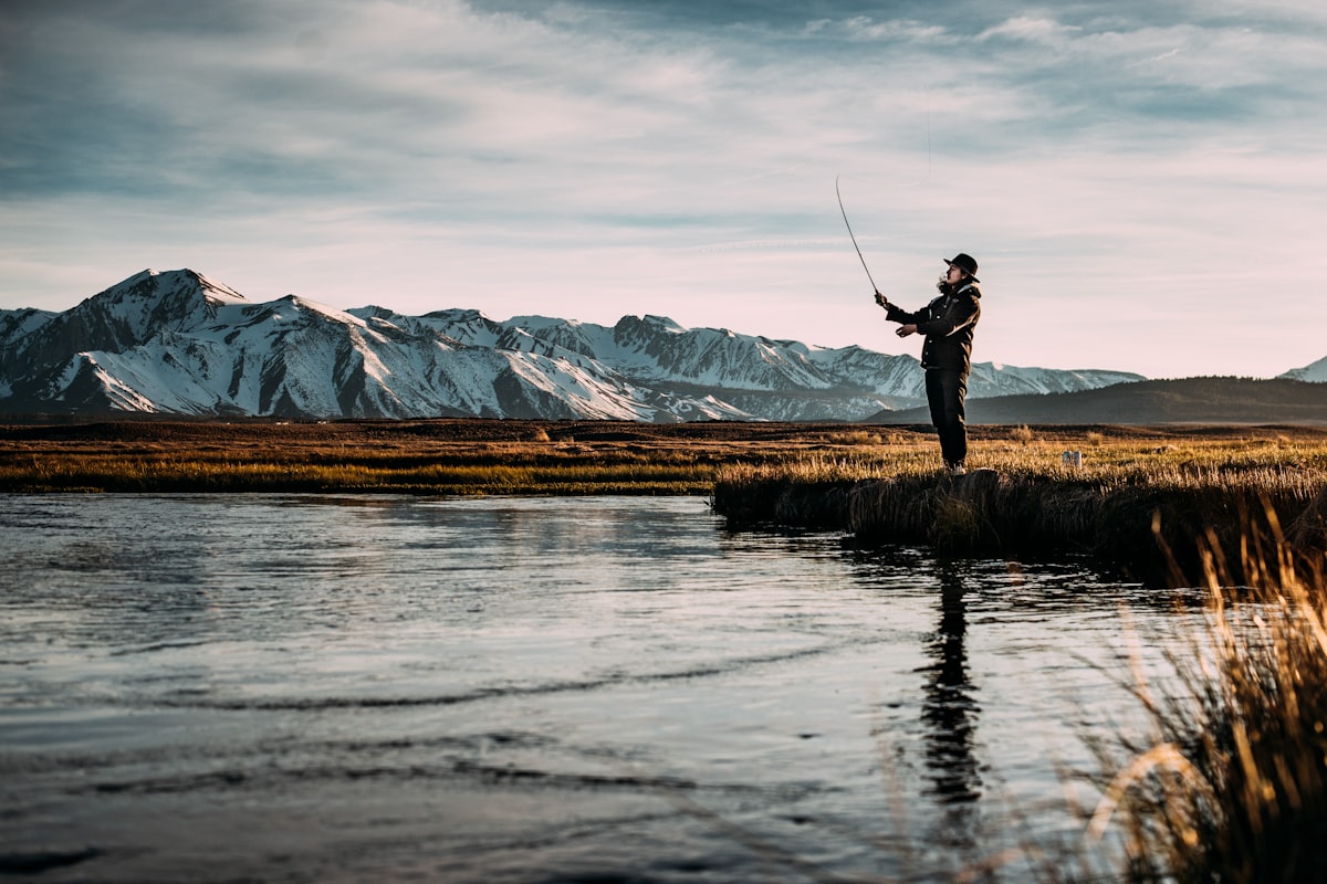 Angler fly fishing on a mountain river
