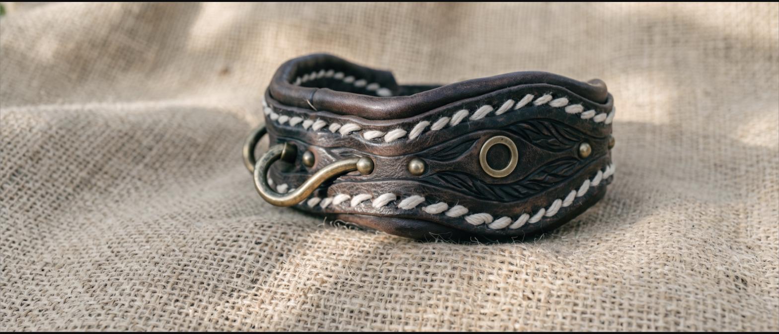 Close-up of hand-stitched tooled leather with brass hardware